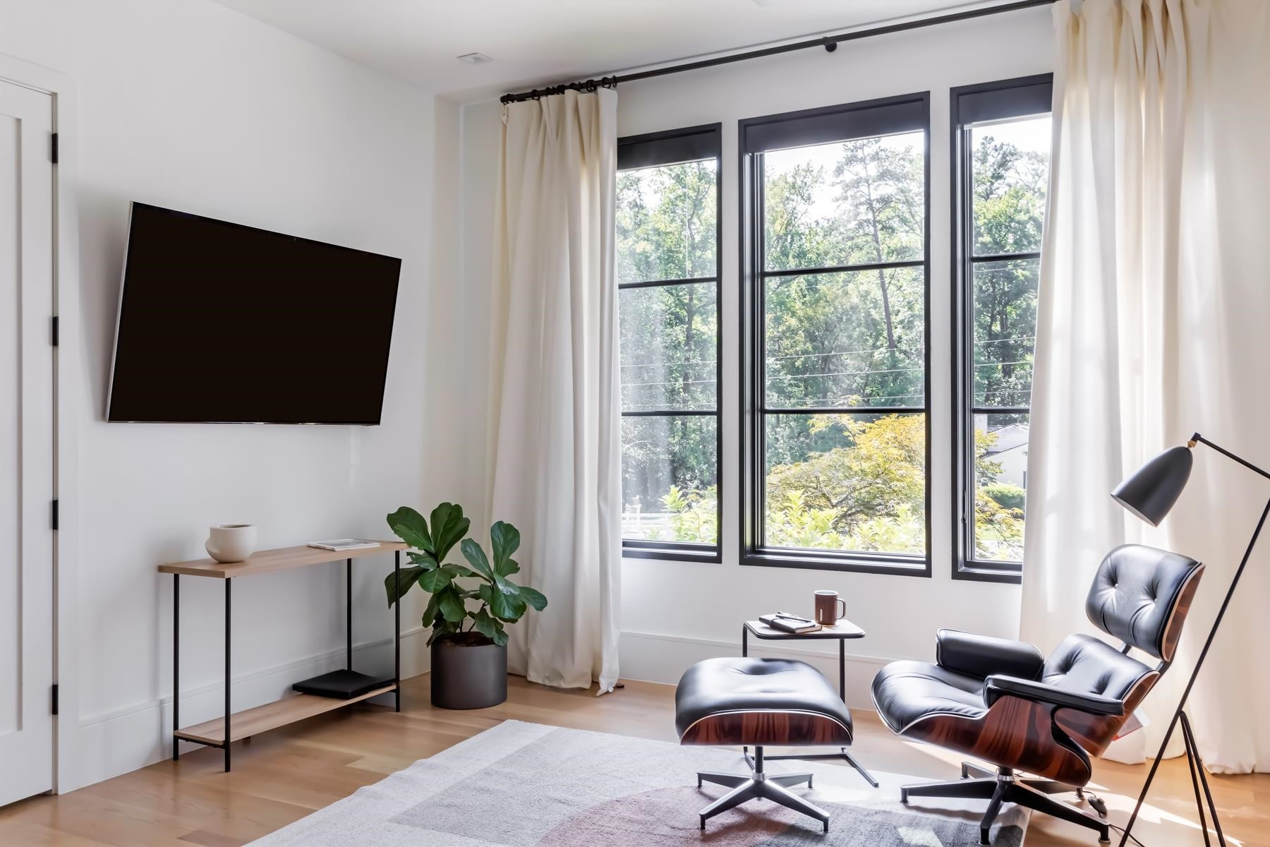 4003 Bristol Road Durham, NC 27707 - Photo 37 of 100 a living room with furniture and a flat screen tv