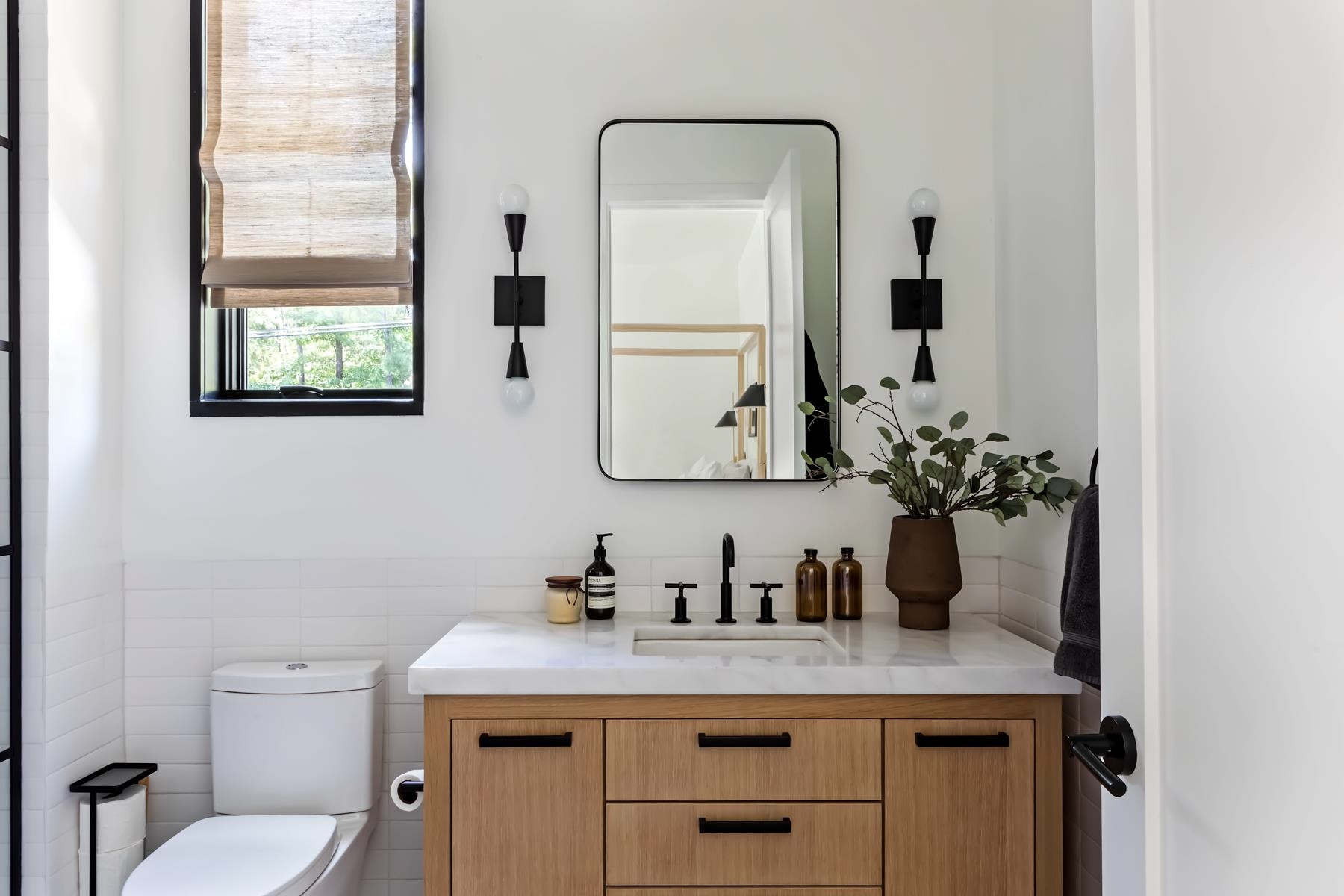 4003 Bristol Road Durham, NC 27707 - Photo 38 of 100 a bathroom with a granite countertop sink a toilet and mirror