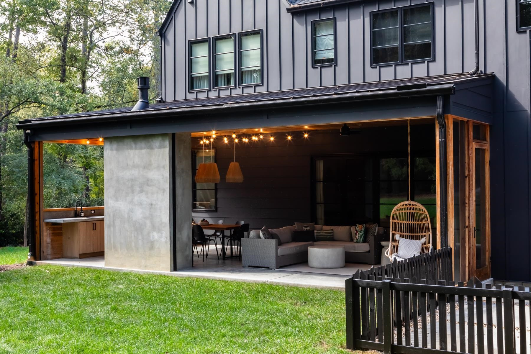 4003 Bristol Road Durham, NC 27707 - Photo 91 of 100 a view of a chair and table in the back yard of the house