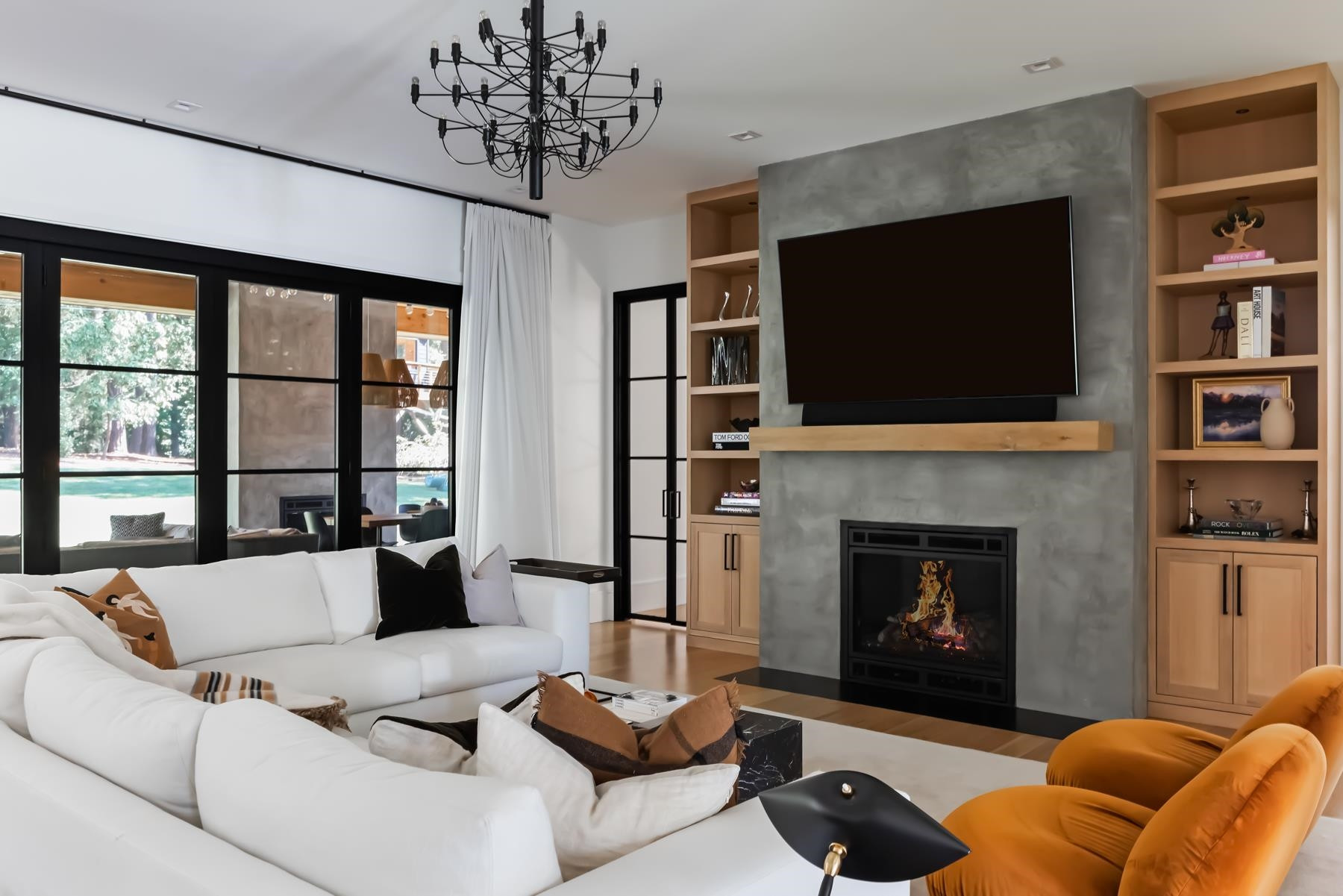 4003 Bristol Road Durham, NC 27707 - Photo 10 of 100 a living room with furniture a fireplace and a flat screen tv