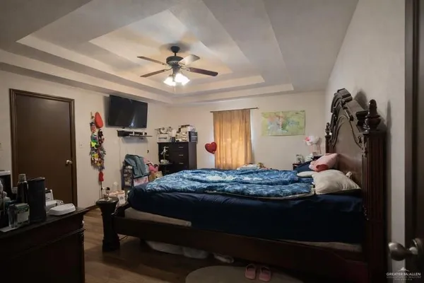 a bed room with a bed mirror and a window