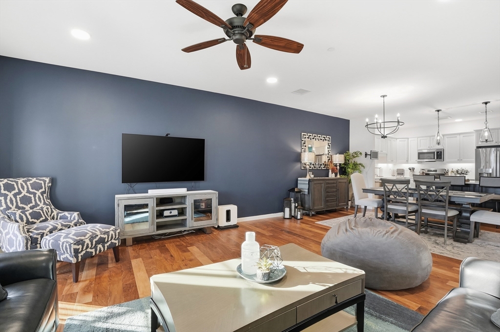 15 Revolution Way, Unit 2205 Canton, MA 02021 - Photo 11 of 34 a living room with furniture and a flat screen tv