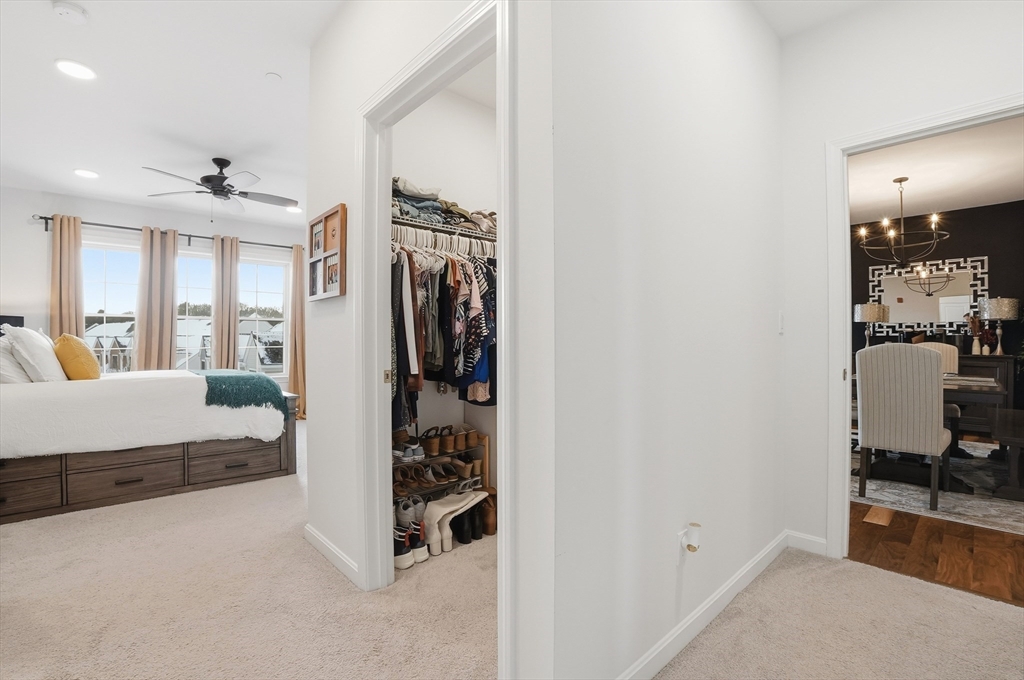 15 Revolution Way, Unit 2205 Canton, MA 02021 - Photo 15 of 34 a bedroom with a bed and a large window with the outer view