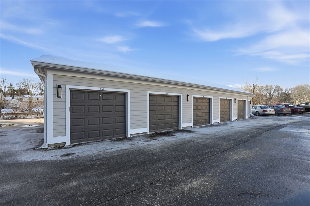 15 Revolution Way, Unit 2205 Canton, MA 02021 - Photo 21 of 34 a view of a house with a large parking space and parking space
