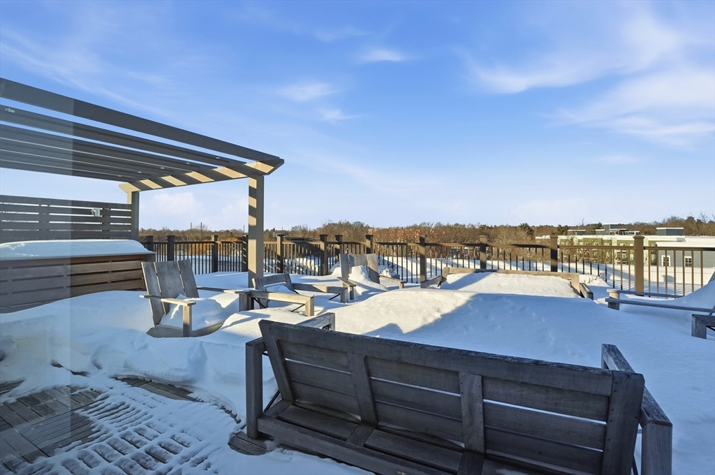 15 Revolution Way, Unit 2205 Canton, MA 02021 - Photo 23 of 34 a view of a roof deck with lounge chairs