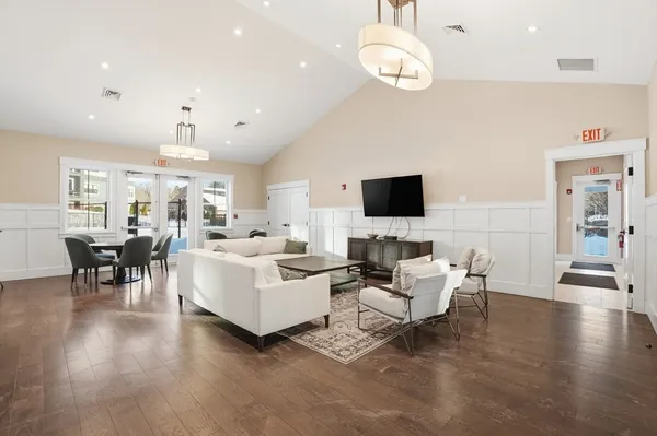 a dining room with furniture and windows