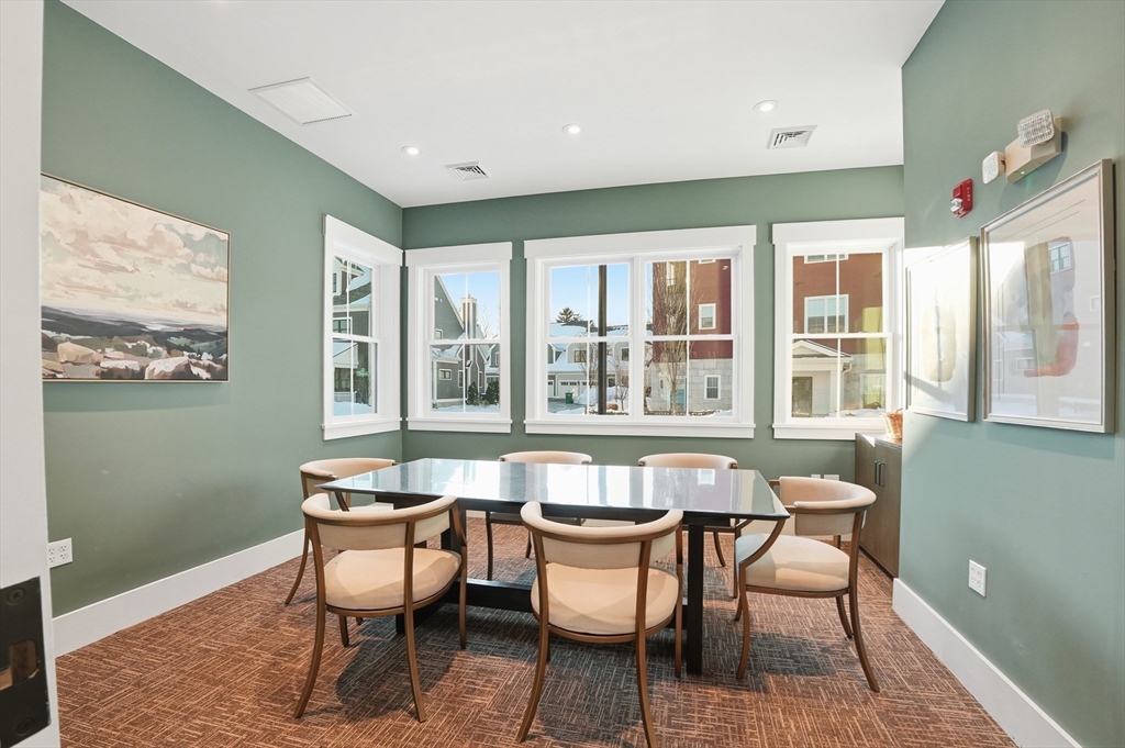 15 Revolution Way, Unit 2205 Canton, MA 02021 - Photo 28 of 34 a dining room with furniture and windows