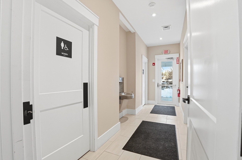 15 Revolution Way, Unit 2205 Canton, MA 02021 - Photo 29 of 34 a bathroom with a shower and a sink