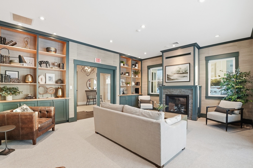 15 Revolution Way, Unit 2205 Canton, MA 02021 - Photo 30 of 34 a living room with furniture and a fireplace