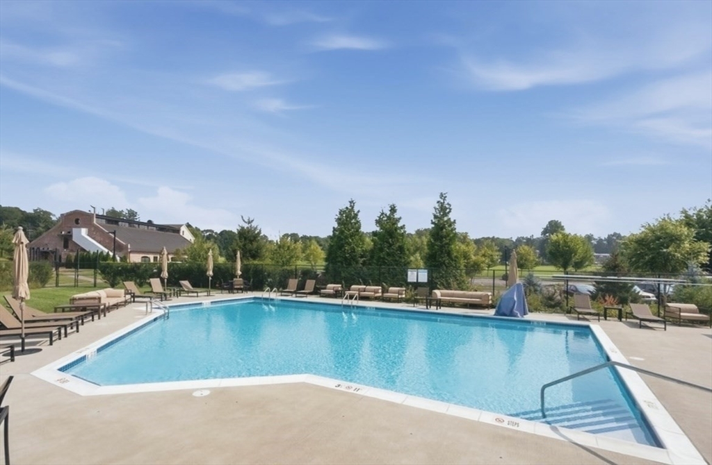 15 Revolution Way, Unit 2205 Canton, MA 02021 - Photo 32 of 34 a view of a swimming pool with a lake view
