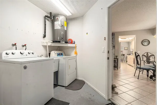 a utility room with closet dryer and washer