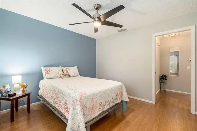 a bedroom with a bed and a table