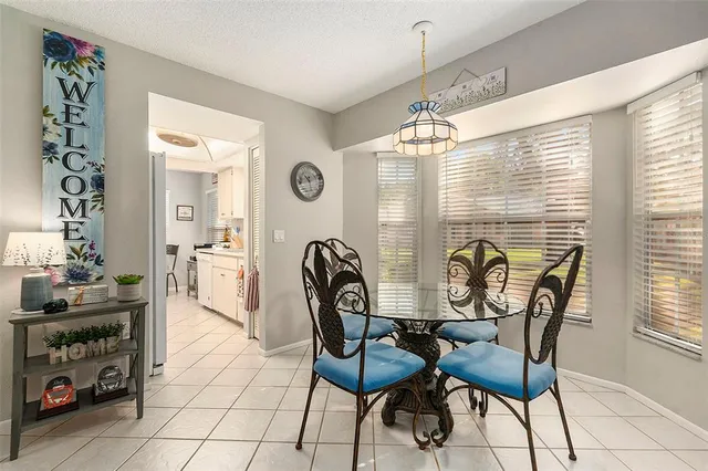 a view of a dining room with furniture and window