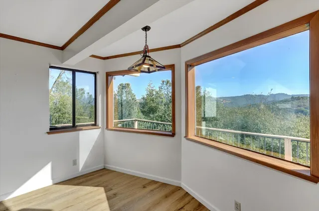 a view of a room with a large window