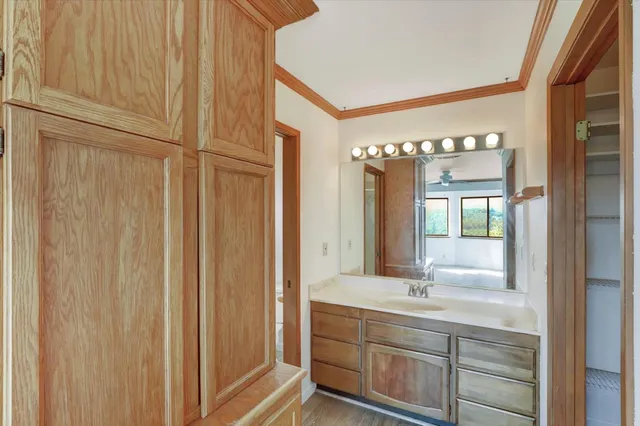 a bathroom with a double vanity sink and mirror