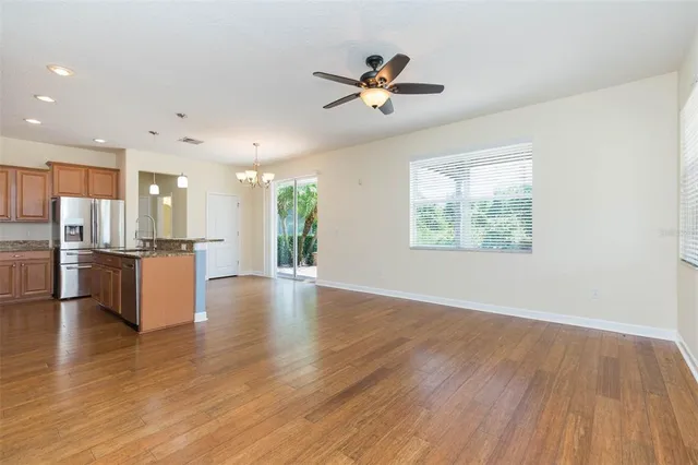 a view of kitchen with cabinets and wooden floor