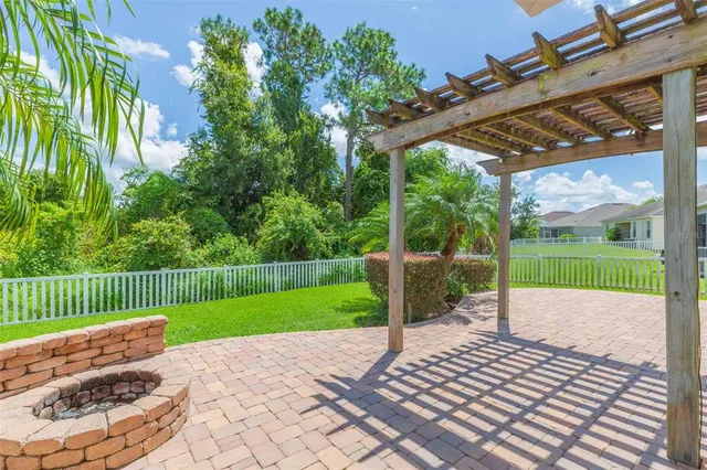 a view of a chair and table in the garden