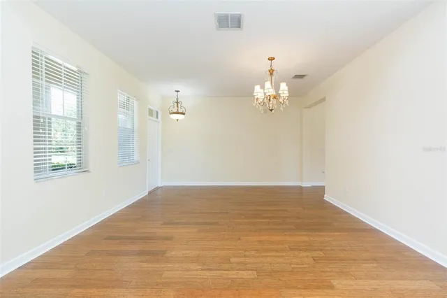 a view of a chandelier in an empty room