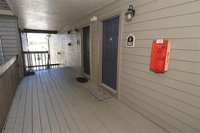 a kitchen with granite countertop a refrigerator and a stove top oven