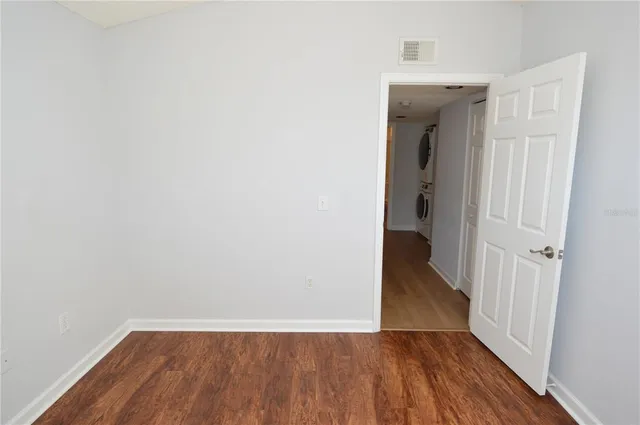 a view of a patio with a table chairs and a backyard