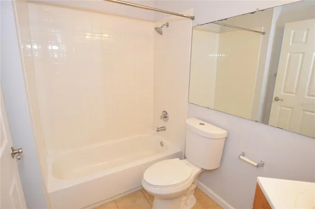 a view of a patio with table and chairs and potted plants