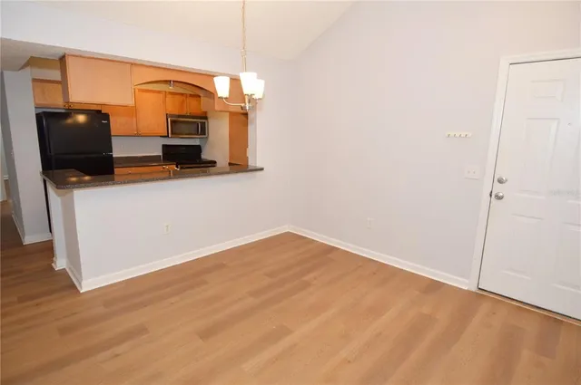 a view of a kitchen from the hallway