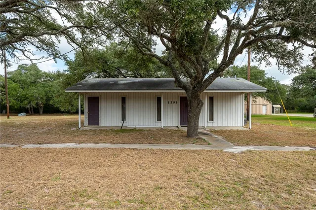 a view of a room with furniture and window