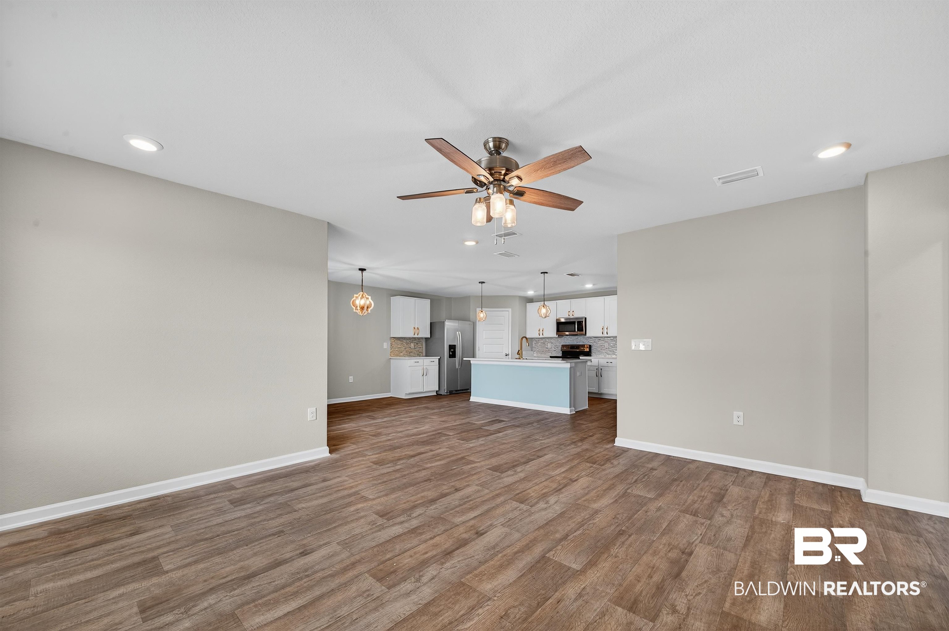 7429 Brompton Drive Foley, AL 36535 - Photo 16 of 50 Unfurnished living room featuring recessed lighting, dark wood-style flooring, and a ceiling fan