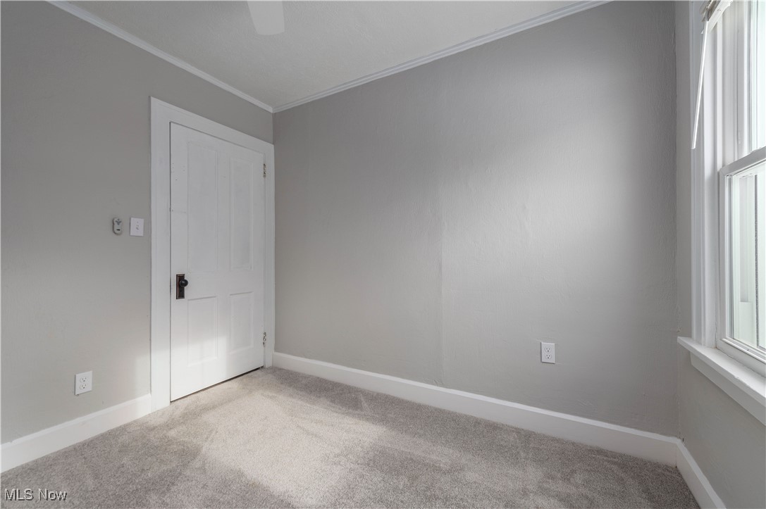 218 Roxboro Road Vermilion, OH 44089 - Photo 29 of 50 Spare room with ornamental molding and light colored carpet