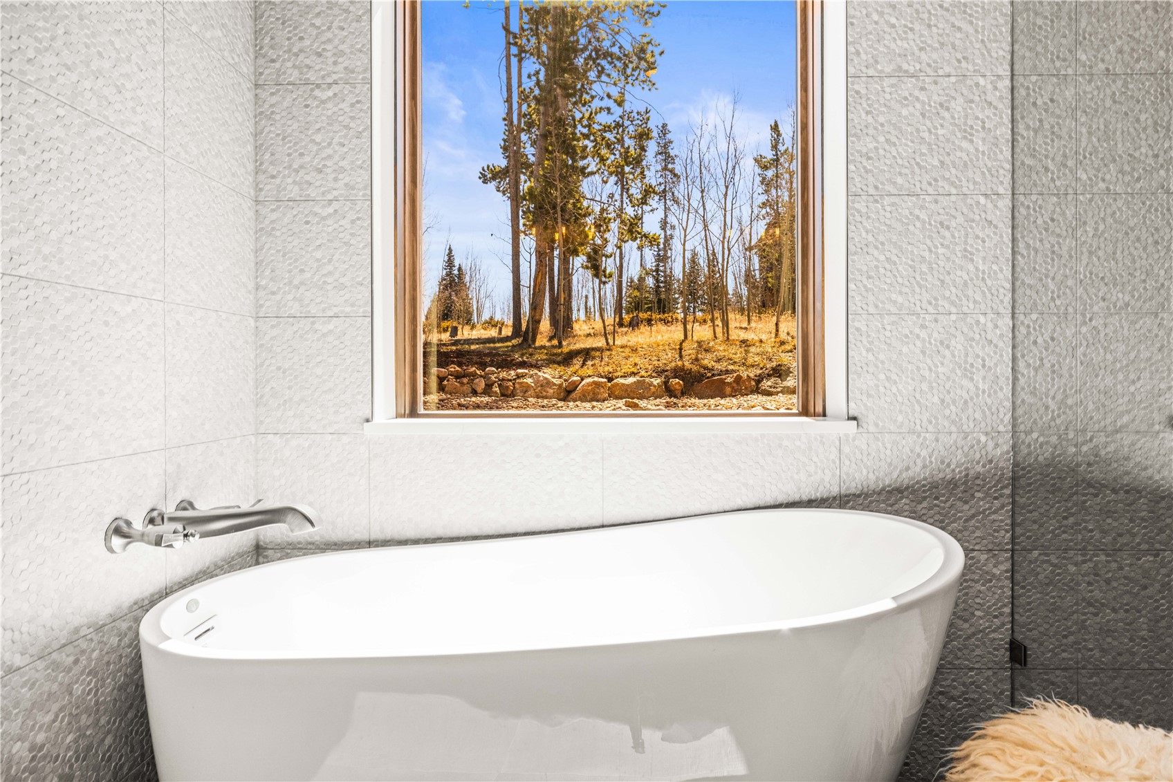 230 Game Trail Road Silverthorne, CO 80498 - Photo 30 of 43 a white bath tub sitting in a bathroom