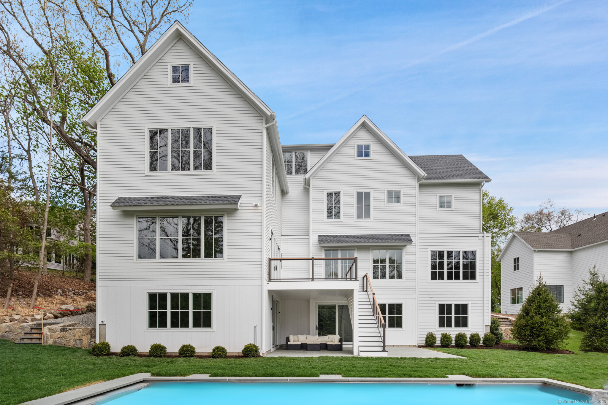 102 Compo Road South Westport, CT 06880 - Photo 2 of 40 a view of white house with a yard and plants