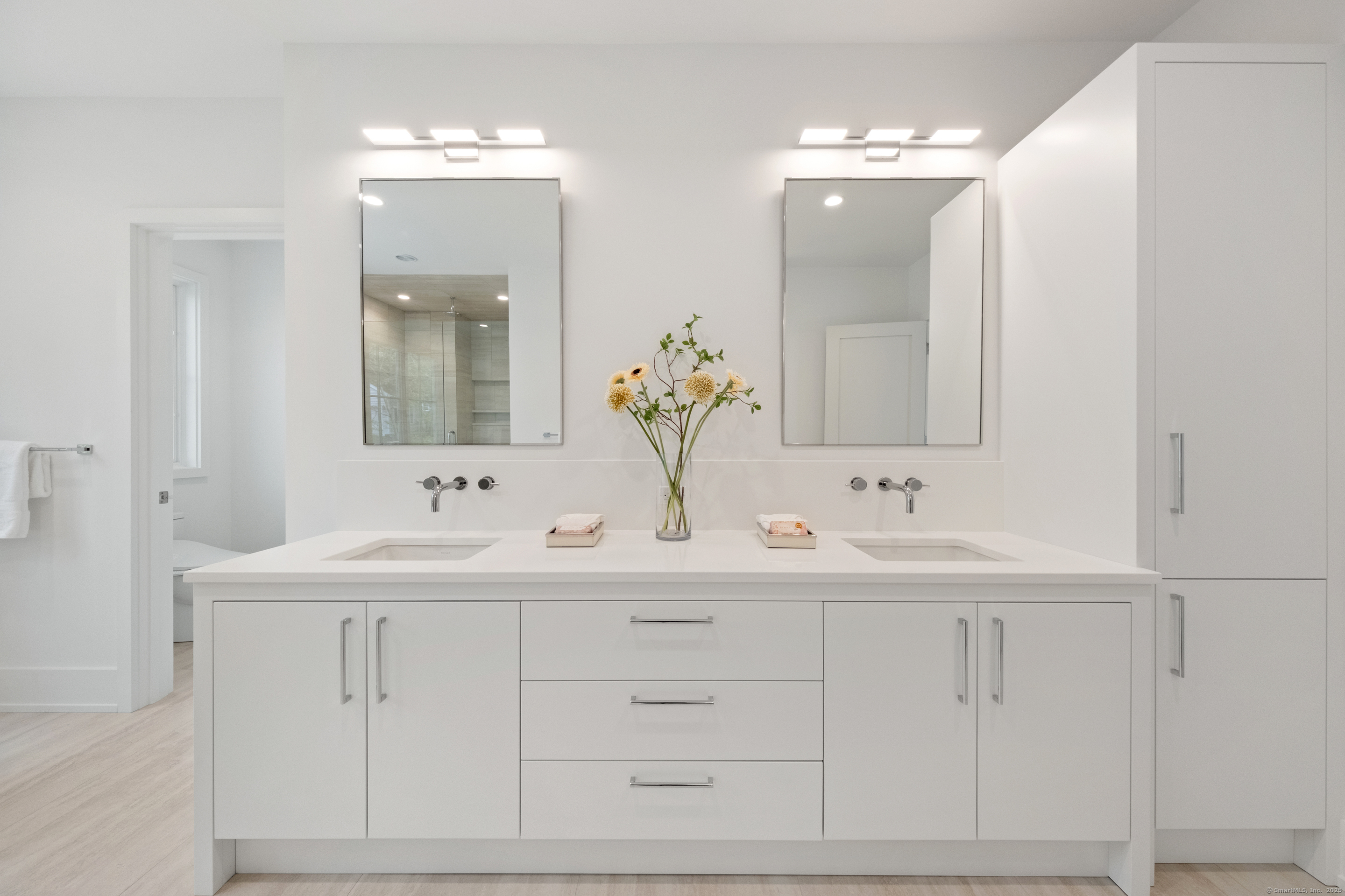 102 Compo Road South Westport, CT 06880 - Photo 22 of 40 a bathroom with a sink vanity and mirror