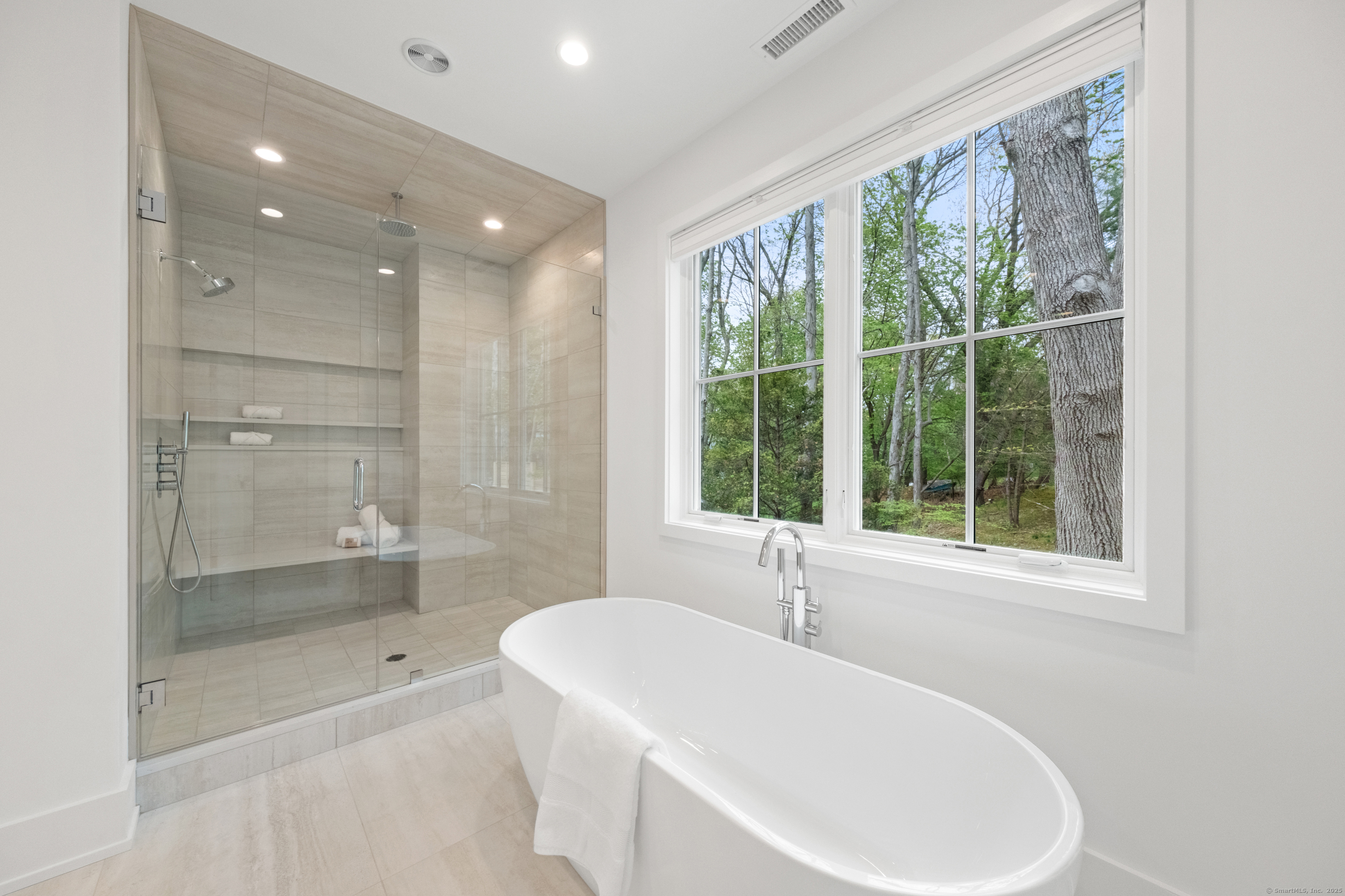 102 Compo Road South Westport, CT 06880 - Photo 23 of 40 a bathroom with a bathtub and shower