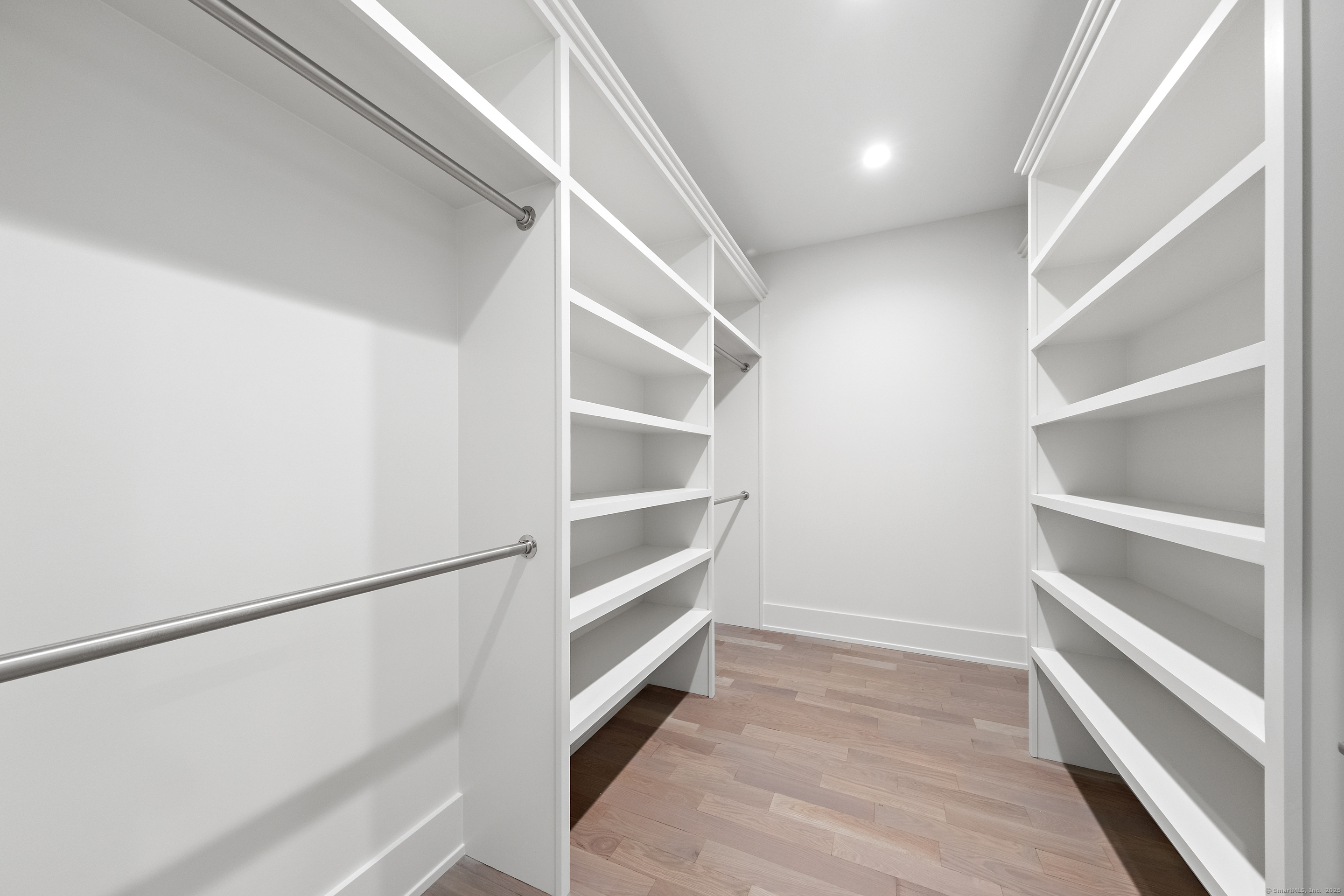 102 Compo Road South Westport, CT 06880 - Photo 24 of 40 a view of walk in closet with empty racks