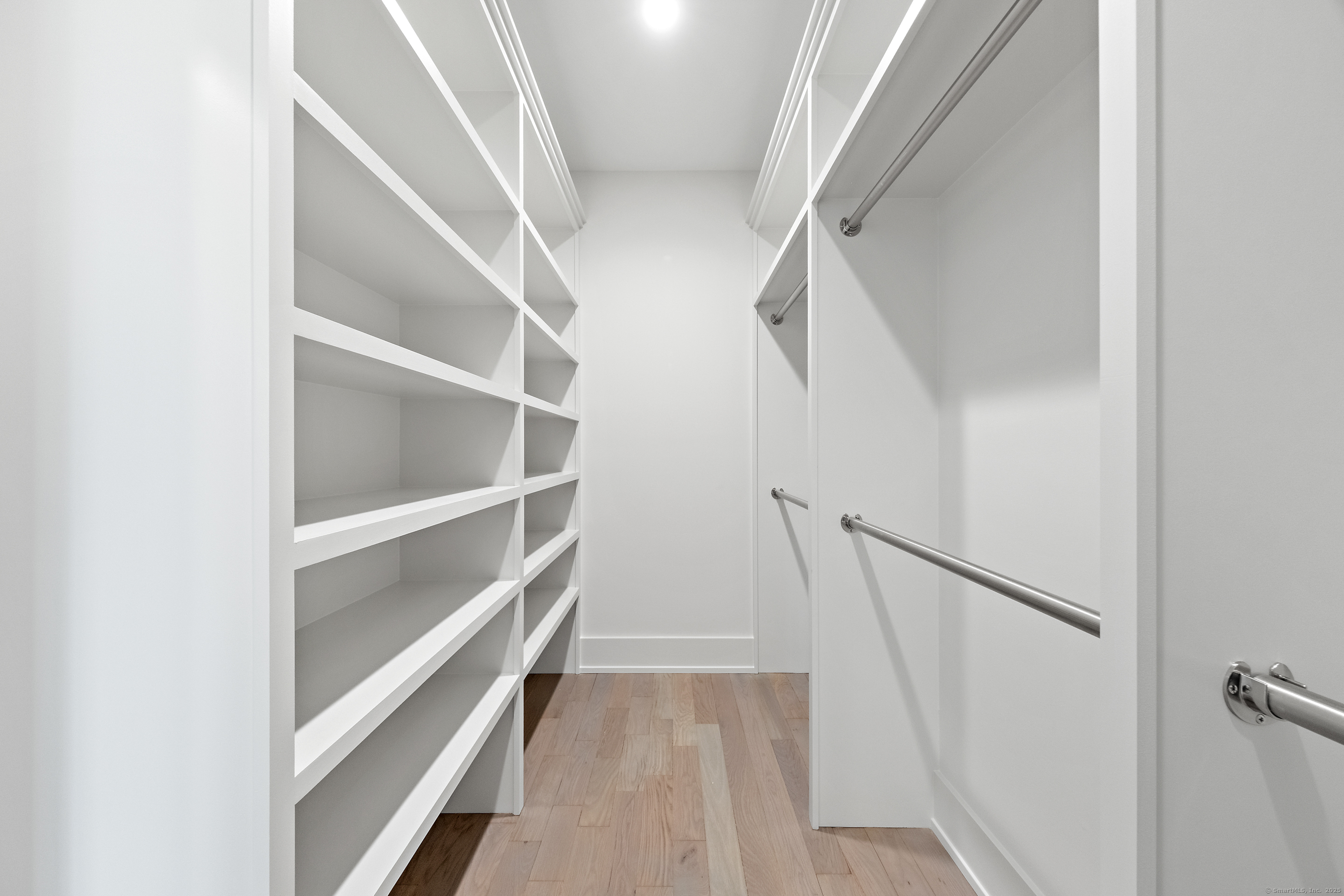 102 Compo Road South Westport, CT 06880 - Photo 25 of 40 a view of walk in closet with empty racks