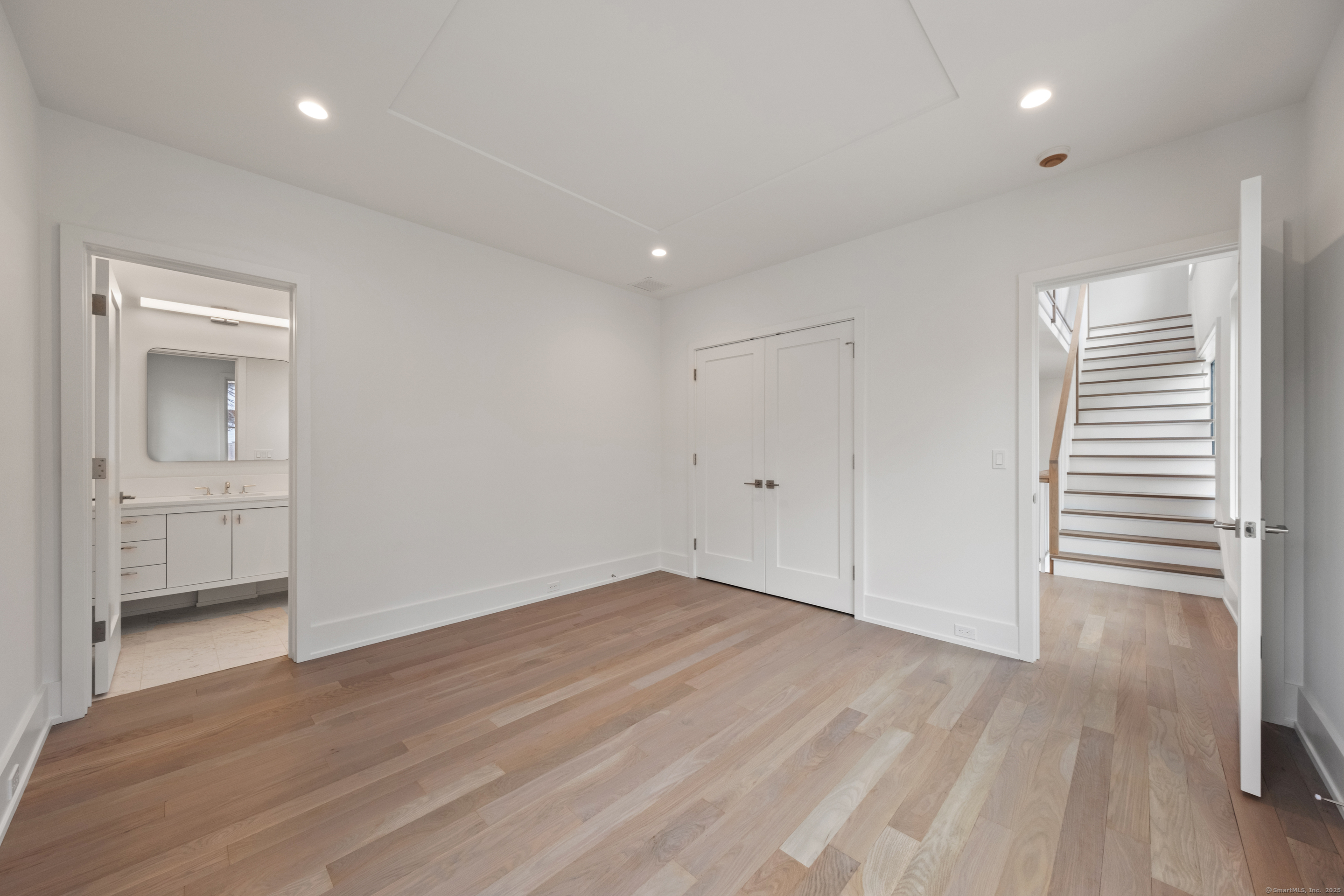102 Compo Road South Westport, CT 06880 - Photo 26 of 40 wooden floor in an empty room with a window