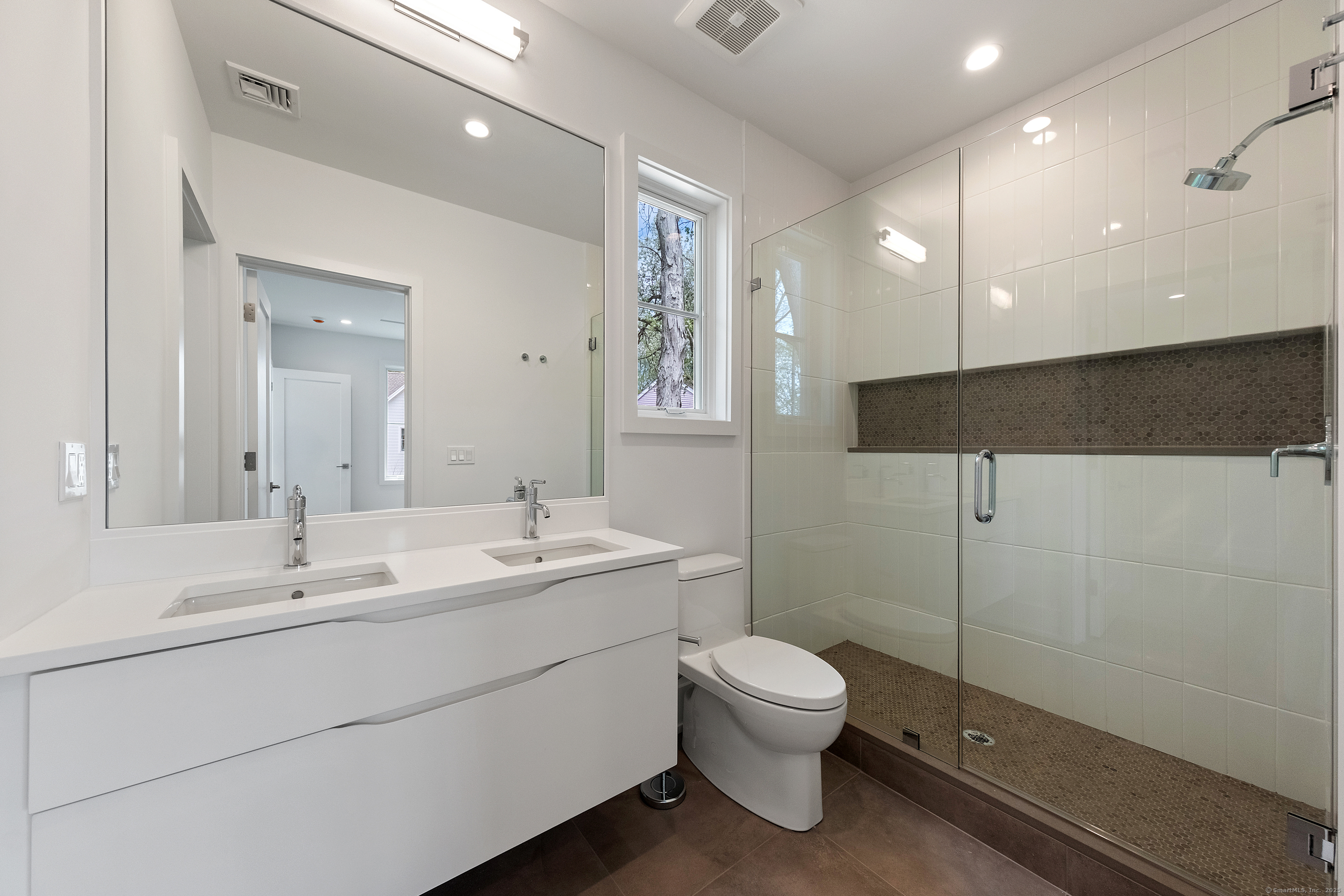 102 Compo Road South Westport, CT 06880 - Photo 29 of 40 a bathroom with a toilet sink and mirror