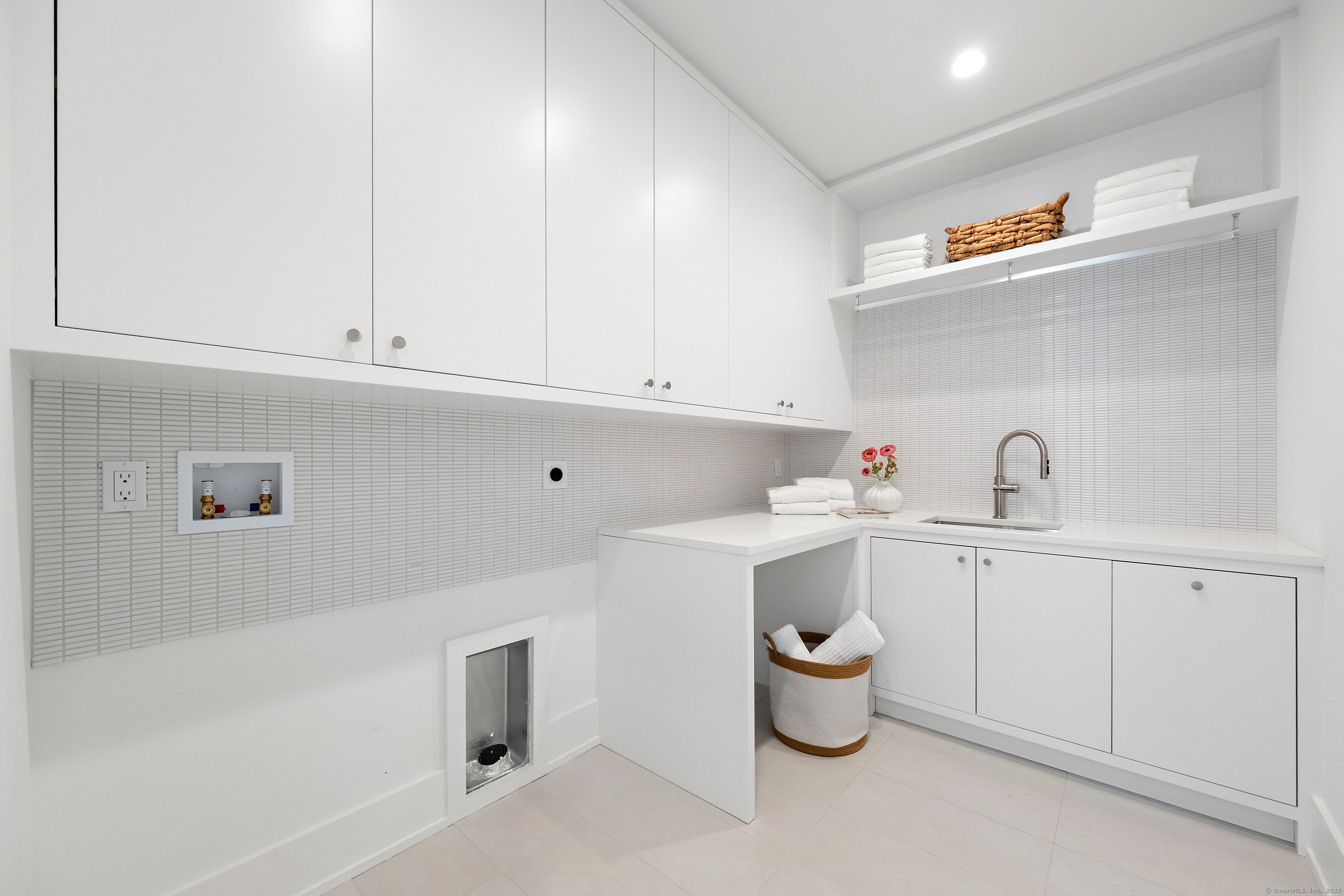 102 Compo Road South Westport, CT 06880 - Photo 32 of 40 a kitchen with a sink dishwasher and cabinets