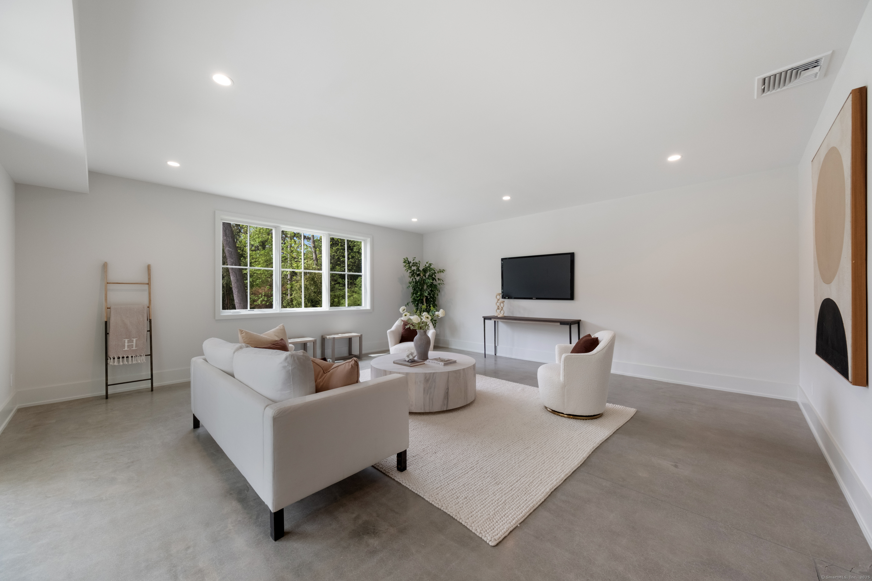 102 Compo Road South Westport, CT 06880 - Photo 37 of 40 a living room with furniture a window and a flat screen tv