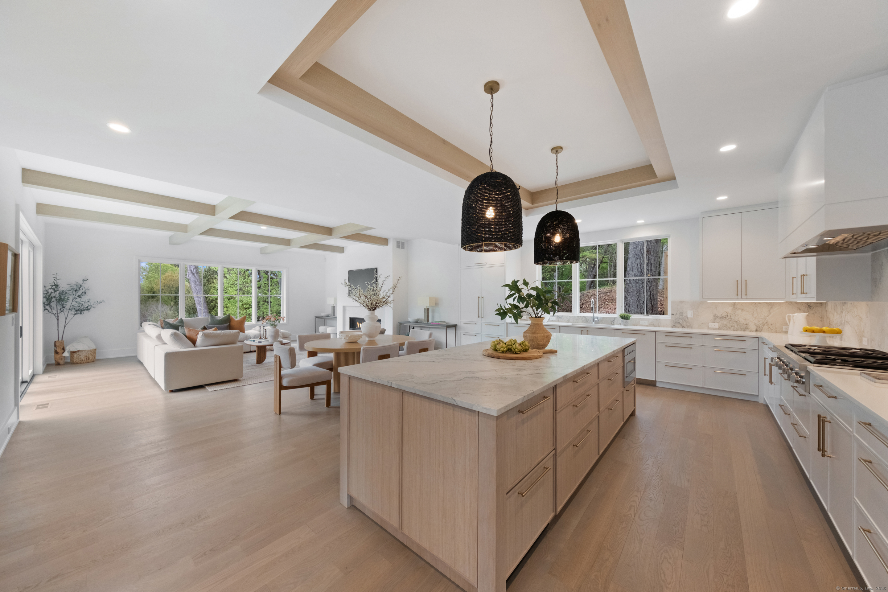 102 Compo Road South Westport, CT 06880 - Photo 6 of 40 a kitchen with stainless steel appliances kitchen island granite countertop a sink a stove and a wooden floors