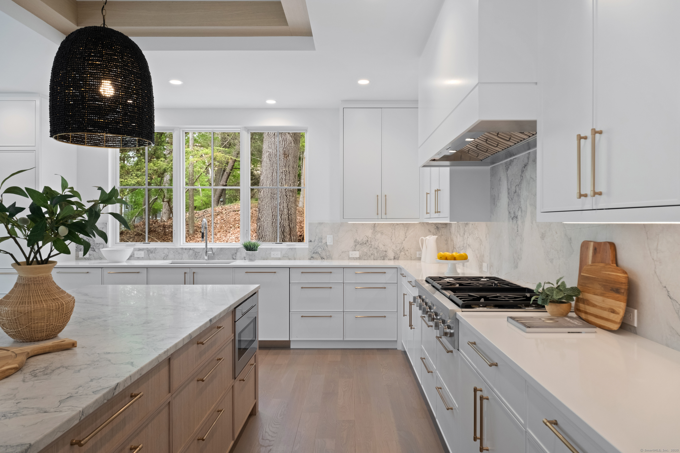 102 Compo Road South Westport, CT 06880 - Photo 7 of 40 a kitchen with sink a window and cabinets