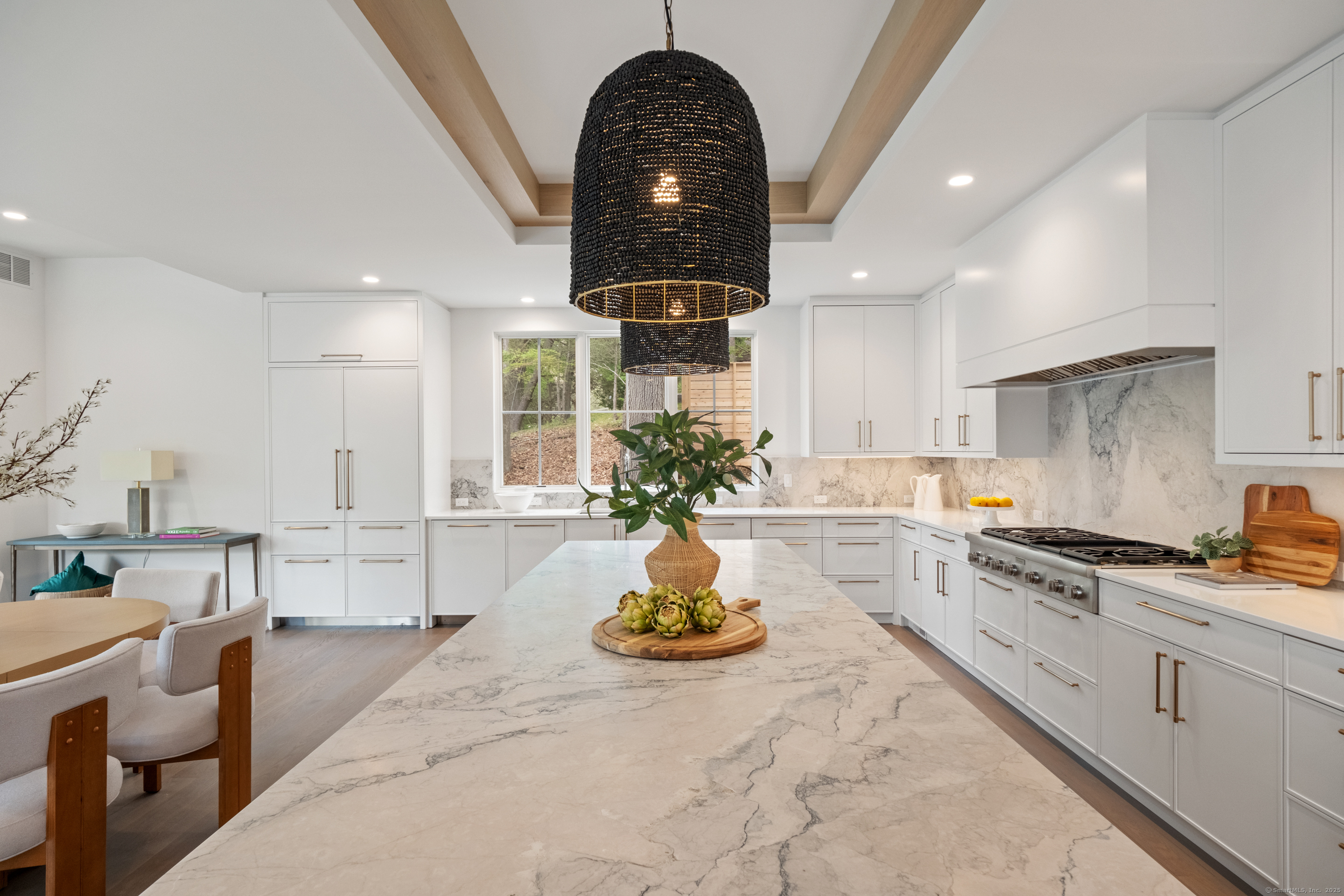 102 Compo Road South Westport, CT 06880 - Photo 8 of 40 a kitchen with stainless steel appliances granite countertop a stove a sink dishwasher a refrigerator and white cabinets with wooden floor