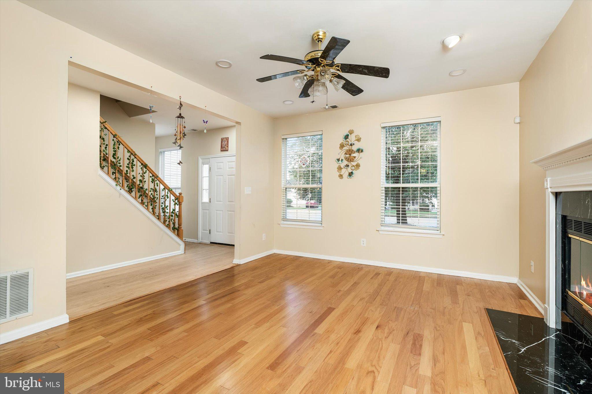 410 Denow Road Pennington, NJ 08534 - Photo 11 of 29 a view of an empty room with wooden floor and a window