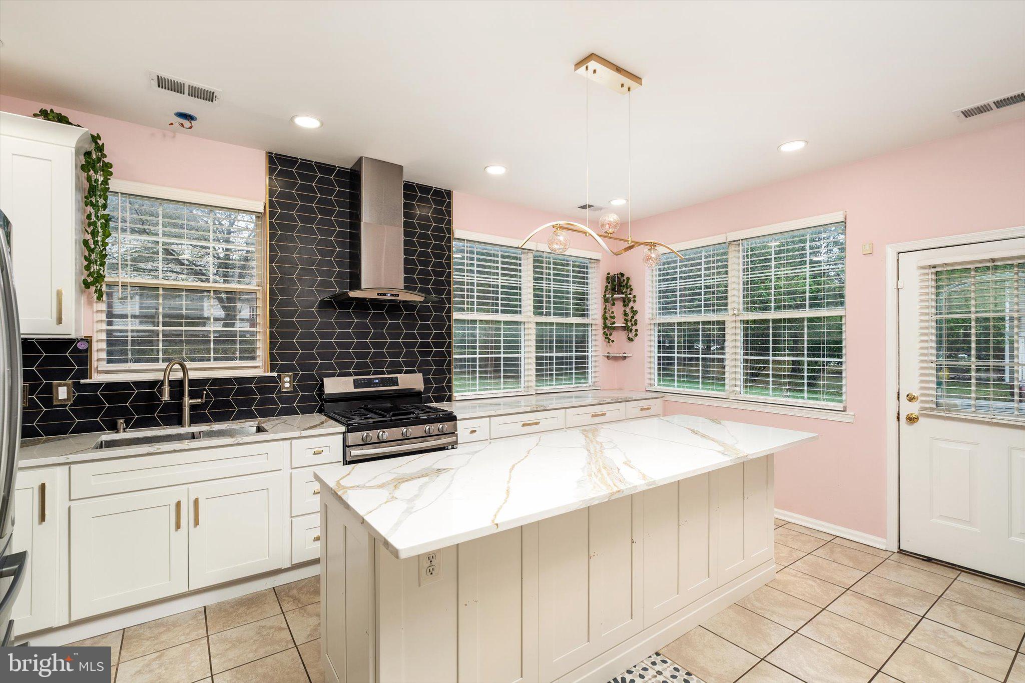 410 Denow Road Pennington, NJ 08534 - Photo 12 of 29 a kitchen with granite countertop a sink and a stove