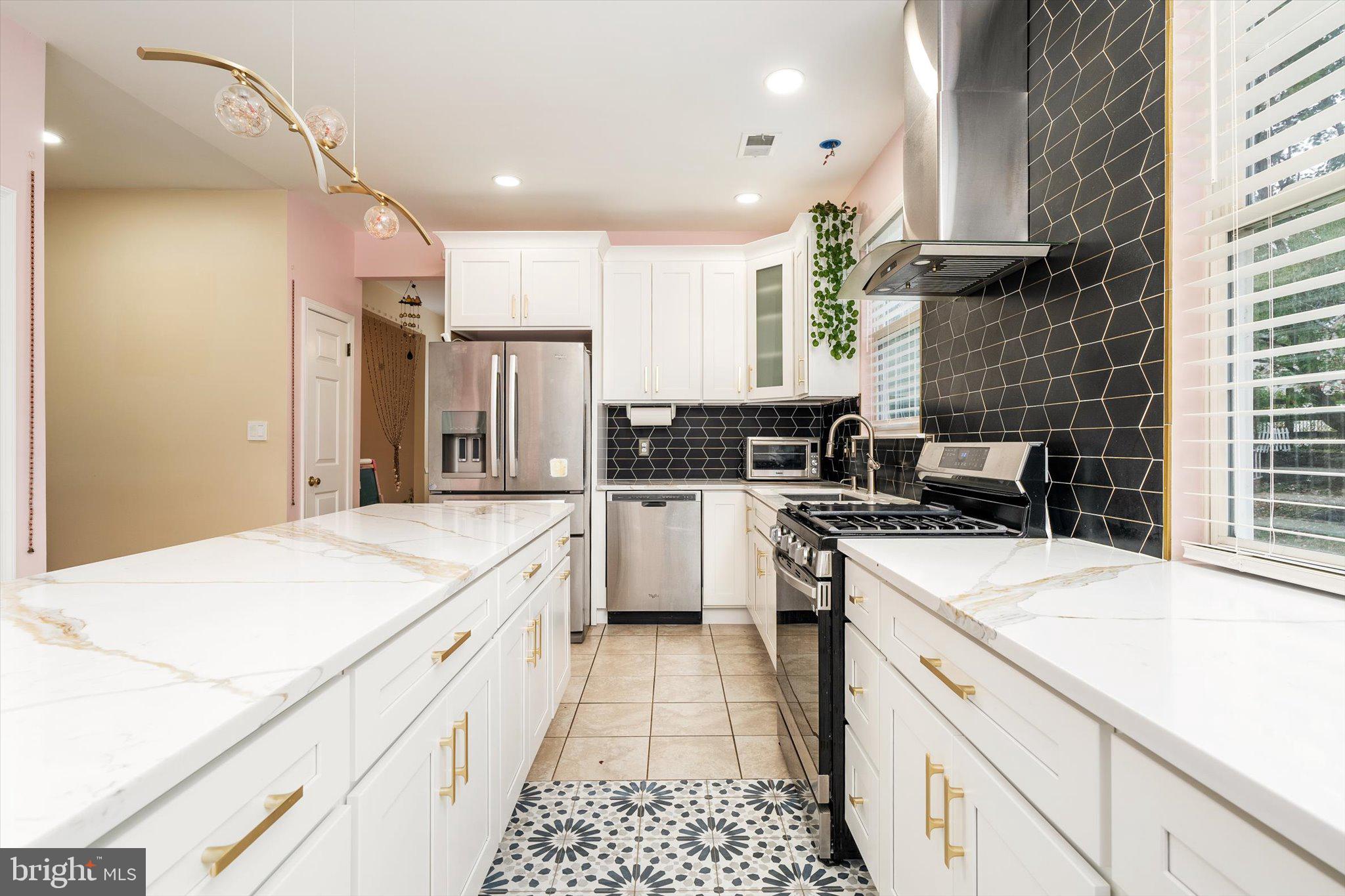 410 Denow Road Pennington, NJ 08534 - Photo 14 of 29 a kitchen with a sink stove and refrigerator