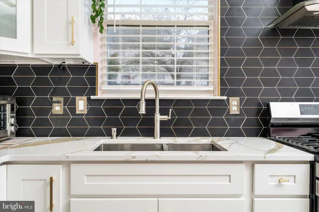 a bathroom with a granite countertop sink