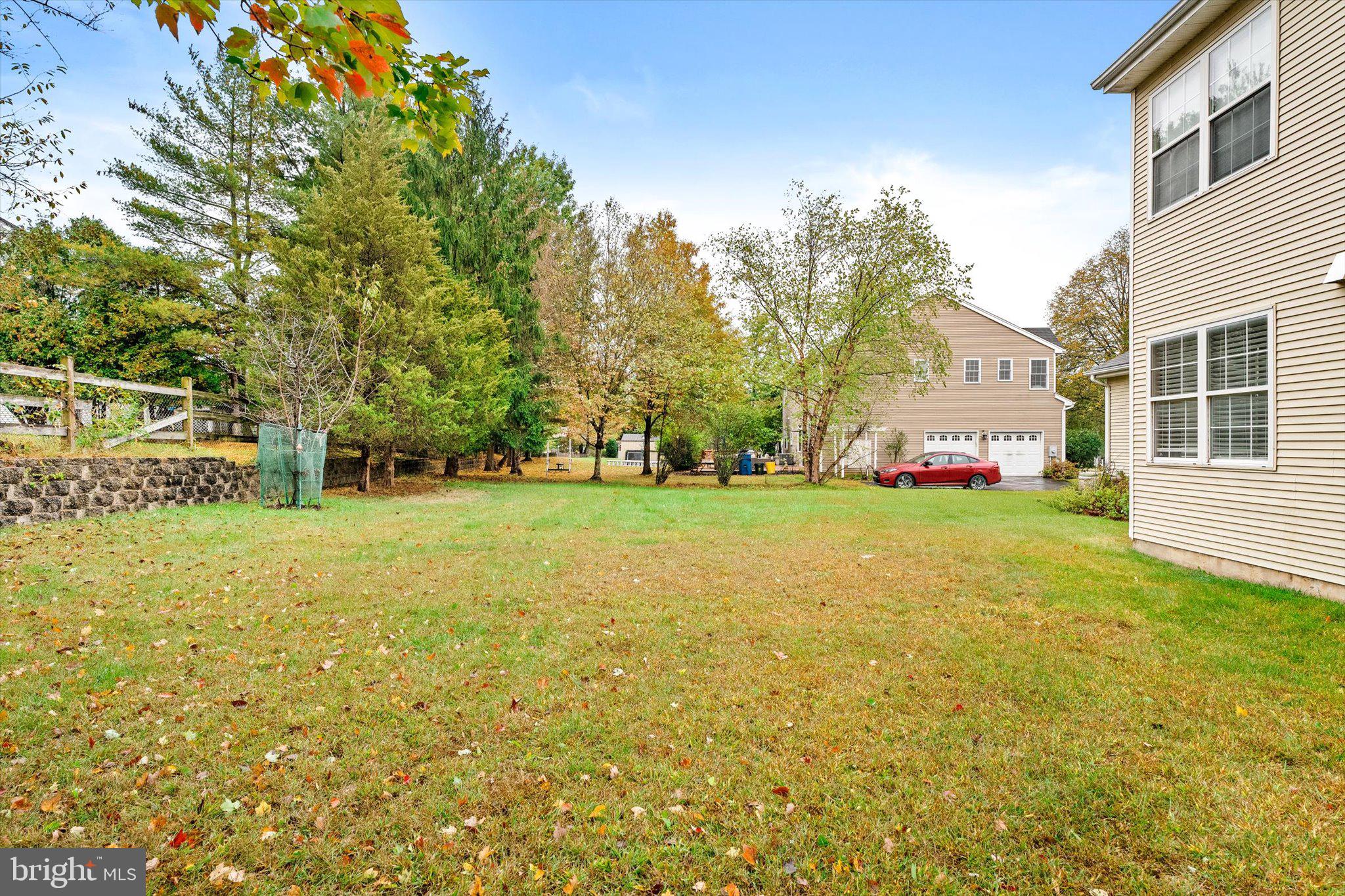 410 Denow Road Pennington, NJ 08534 - Photo 29 of 29 a view of a tree in front of a house with a big yard