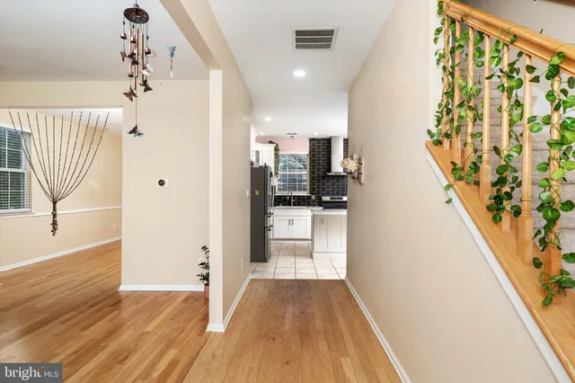 a view of a kitchen from the entryway