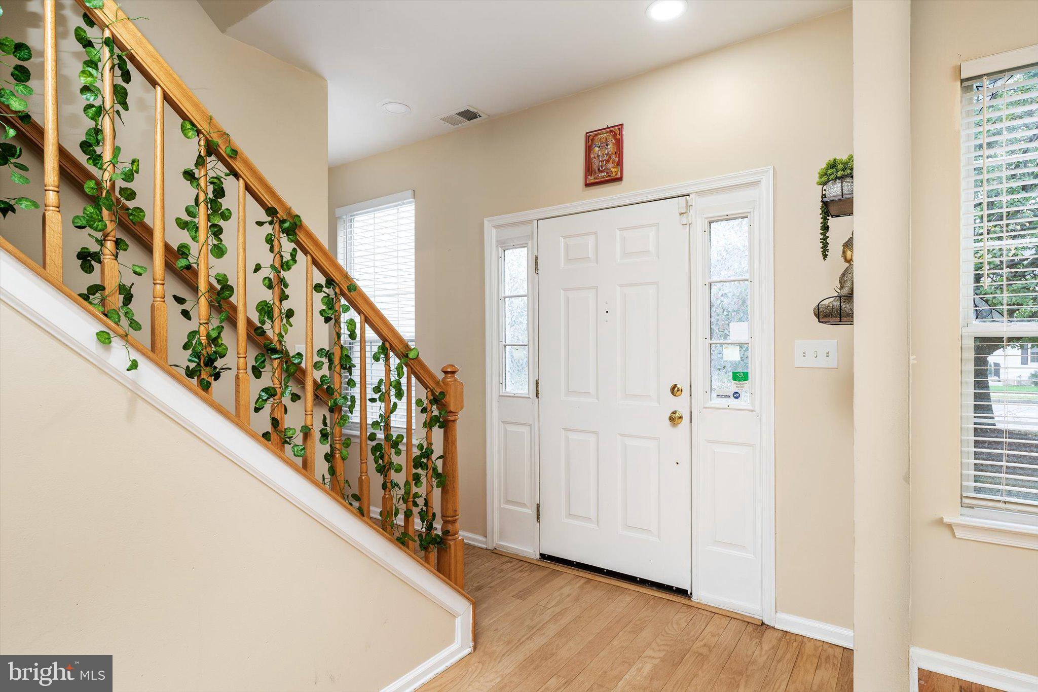 410 Denow Road Pennington, NJ 08534 - Photo 5 of 29 a view of a entryway with wooden floor