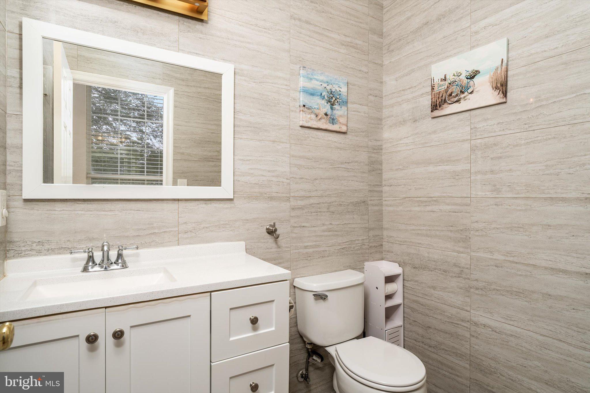 410 Denow Road Pennington, NJ 08534 - Photo 6 of 29 a bathroom with a toilet sink and mirror